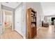 Hallway featuring hardwood floors, a view to the bathroom, and a bookcase at 137 Hidden Lake Cir, Canton, GA 30114