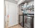 Modern laundry room with washer, dryer, and shelving at 137 Hidden Lake Cir, Canton, GA 30114