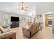Spacious living and dining area featuring hardwood floors and comfortable seating at 137 Hidden Lake Cir, Canton, GA 30114
