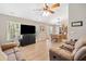 Open-concept living and dining area featuring hardwood floors and recessed lighting at 137 Hidden Lake Cir, Canton, GA 30114