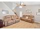 Spacious living room with hardwood floors, high ceilings, and comfortable seating at 137 Hidden Lake Cir, Canton, GA 30114
