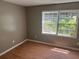 Bedroom features laminate floors and a window providing natural light at 273 Fennel Way, Atlanta, GA 30331
