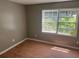 Bedroom features laminate floors and a window providing natural light at 273 Fennel Way, Atlanta, GA 30331