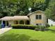 Charming two-story home with a brick facade, arched entryway, and a well-manicured lawn at 273 Fennel Way, Atlanta, GA 30331