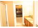The bathroom features double sinks with a bedroom that can be seen through a doorway at 1109 Norsworthy Ml, Hampton, GA 30228