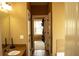 Hallway between the bathroom and closet is brightly lit with neutral colors at 1109 Norsworthy Ml, Hampton, GA 30228