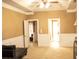 Large bedroom has a ceiling fan, crown molding, and wainscoting with multiple entrances at 1109 Norsworthy Ml, Hampton, GA 30228
