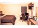 Comfortable bedroom with a dedicated desk area and a wall-mounted TV for entertainment at 1109 Norsworthy Ml, Hampton, GA 30228