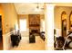 Spacious living room featuring a fireplace, ceiling fan, and comfortable seating at 1109 Norsworthy Ml, Hampton, GA 30228