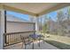 Covered back porch featuring a dining table and chairs overlooking the yard at 1936 Waycross Ln, Dacula, GA 30019