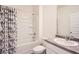 Bathroom with a shower-tub combo and a large mirror over the vanity at 1936 Waycross Ln, Dacula, GA 30019