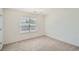 Bedroom featuring a chandelier, a window, neutral walls, and carpet at 1936 Waycross Ln, Dacula, GA 30019