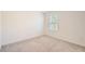 Bright bedroom with a window allowing natural light to fill the space at 1936 Waycross Ln, Dacula, GA 30019