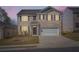 Charming two-story brick home with a two-car garage and well-maintained front lawn at 1936 Waycross Ln, Dacula, GA 30019