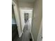 Hallway with gray wood flooring leading to the front door and other rooms at 3730 Clovis Court Northwest Nw Ct, Atlanta, GA 30331