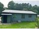 Charming home with blue siding, metal roof, and a well-maintained lawn at 3730 Clovis Court Northwest Nw Ct, Atlanta, GA 30331