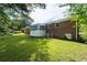 A spacious backyard with grass and a back porch at 999 Chestnut Oak Ct, Lawrenceville, GA 30046