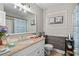 Cozy bathroom featuring a granite countertop vanity and a framed mirror at 999 Chestnut Oak Ct, Lawrenceville, GA 30046