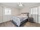 Bedroom with a bed and dark hardwood floors at 999 Chestnut Oak Ct, Lawrenceville, GA 30046