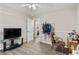 Bedroom with hardwood floors and a view into the hall at 999 Chestnut Oak Ct, Lawrenceville, GA 30046
