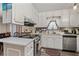 Bright kitchen featuring white cabinets, stainless steel appliances, and modern countertops at 999 Chestnut Oak Ct, Lawrenceville, GA 30046