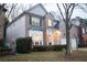 Inviting two-story home with brick accents, well-maintained landscaping, and a two-car garage at 6674 Mimosa Cir, Tucker, GA 30084