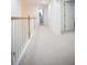 Upstairs hallway with neutral carpeting and classic white trim at 6674 Mimosa Cir, Tucker, GA 30084