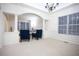 Bright living room with white trim and arched doorways to other rooms at 6674 Mimosa Cir, Tucker, GA 30084