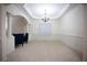 Bright living room with white trim and arched doorways to other rooms at 6674 Mimosa Cir, Tucker, GA 30084