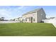 Large backyard with ample lawn space, complemented by a white picket fence at 1049 Bodega Loop, Locust Grove, GA 30248