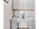 Charming gray desk area with built-in cabinets and drawers, perfect for a home office setup at 1049 Bodega Loop, Locust Grove, GA 30248
