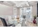 Bright dining area featuring modern décor, stylish lighting, and a glass-top table set at 1049 Bodega Loop, Locust Grove, GA 30248