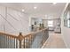 Hallway with decorative wall trim leading to an upstairs living space at 1049 Bodega Loop, Locust Grove, GA 30248
