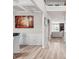 Open-concept hallway with wood flooring, modern decor, and easy access to the living spaces at 1049 Bodega Loop, Locust Grove, GA 30248