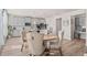Open kitchen features stainless appliances, gray cabinets, light countertops, and eat-in kitchen area at 1049 Bodega Loop, Locust Grove, GA 30248