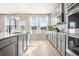 Bright kitchen featuring stainless steel appliances, lots of cabinets and lots of natural light at 1049 Bodega Loop, Locust Grove, GA 30248