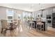 Spacious open kitchen featuring a large island with bar seating, gray cabinets and modern lighting at 1049 Bodega Loop, Locust Grove, GA 30248