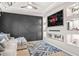 Living room featuring a sectional sofa, media console, and recessed shelves at 1049 Bodega Loop, Locust Grove, GA 30248