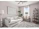 Cozy living area with comfortable seating, bright window, and stylish decor at 1049 Bodega Loop, Locust Grove, GA 30248