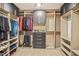 Spacious walk-in closet with custom shelving, hanging rods, and storage drawers at 1049 Bodega Loop, Locust Grove, GA 30248