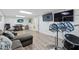 Finished basement featuring living area and entertainment setup with mounted TV's at 1051 Rock Springs Rd, Lawrenceville, GA 30043