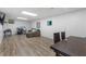Spacious finished basement featuring wood-look floors, a drum set, and space for recreation at 1051 Rock Springs Rd, Lawrenceville, GA 30043