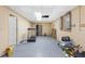 Basement with neutral-colored walls, utility panels, and a treadmill on the gray floor at 1051 Rock Springs Rd, Lawrenceville, GA 30043