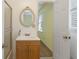 Well-lit bathroom featuring a single vanity and a connecting door to the bedroom at 1051 Rock Springs Rd, Lawrenceville, GA 30043