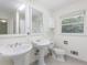 Bathroom with double sinks, a window, decorative tiles, and lots of natural light at 1051 Rock Springs Rd, Lawrenceville, GA 30043