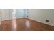 Bright bedroom with new laminate flooring, neutral paint, and access to the ensuite bathroom at 1051 Rock Springs Rd, Lawrenceville, GA 30043