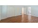 Spacious bedroom featuring laminate floors, a closet, and a connecting door to the bathroom at 1051 Rock Springs Rd, Lawrenceville, GA 30043