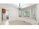 Breakfast nook with a chandelier and large windows bringing in natural light at 1051 Rock Springs Rd, Lawrenceville, GA 30043