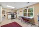 Functional kitchen features an eating area, white cabinetry, and views of the outdoor deck at 1051 Rock Springs Rd, Lawrenceville, GA 30043