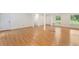 Expansive living room boasting hardwood floors, multiple access points, and great natural light at 1051 Rock Springs Rd, Lawrenceville, GA 30043